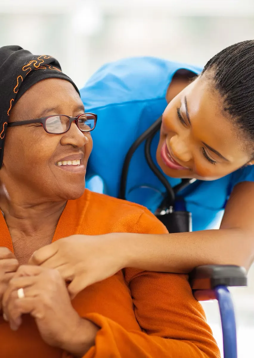 Caring provider with a patient in a wheelchair